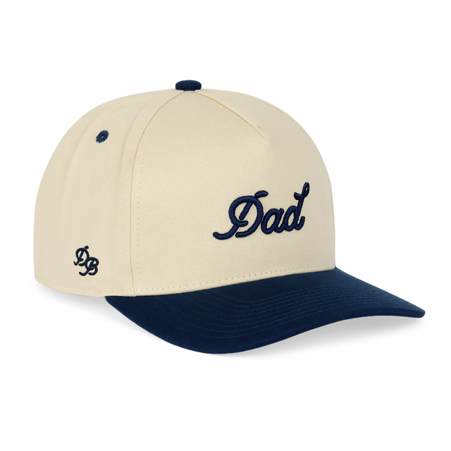 Beige and navy cap with 'Dad' text on a white background
Details
